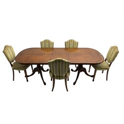 Regency design walnut twin pedestal extending dining table, rectangular burr top with rounded corners and crossbanding, raised on turned vasiform columns with tripod base, with additional leaf (D107cm W184cm/230cm, H76cm); and set eight (6+2) shield back dining chairs, upholstered in striped laurel green fabric, raised on tapering supports with spade feet, retailed by Geoffrey Benson