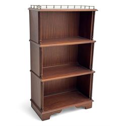 Mid-20th century mahogany open bookshelf, the rectangular top with a brass balustrade gall...