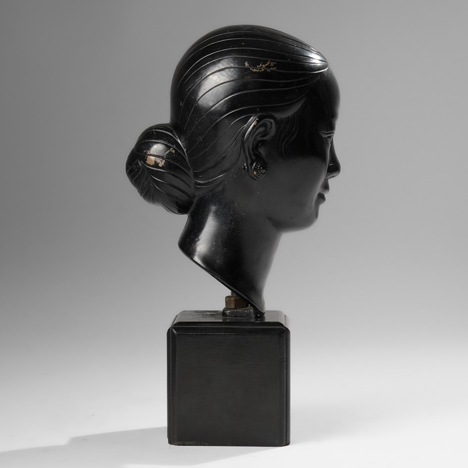 Manner of Nguyen Thanh Le (Vietnamese 1919-2006): Head of a Woman, bronze bust with indistinct character signature to neck, on ebonised base, H27cm 