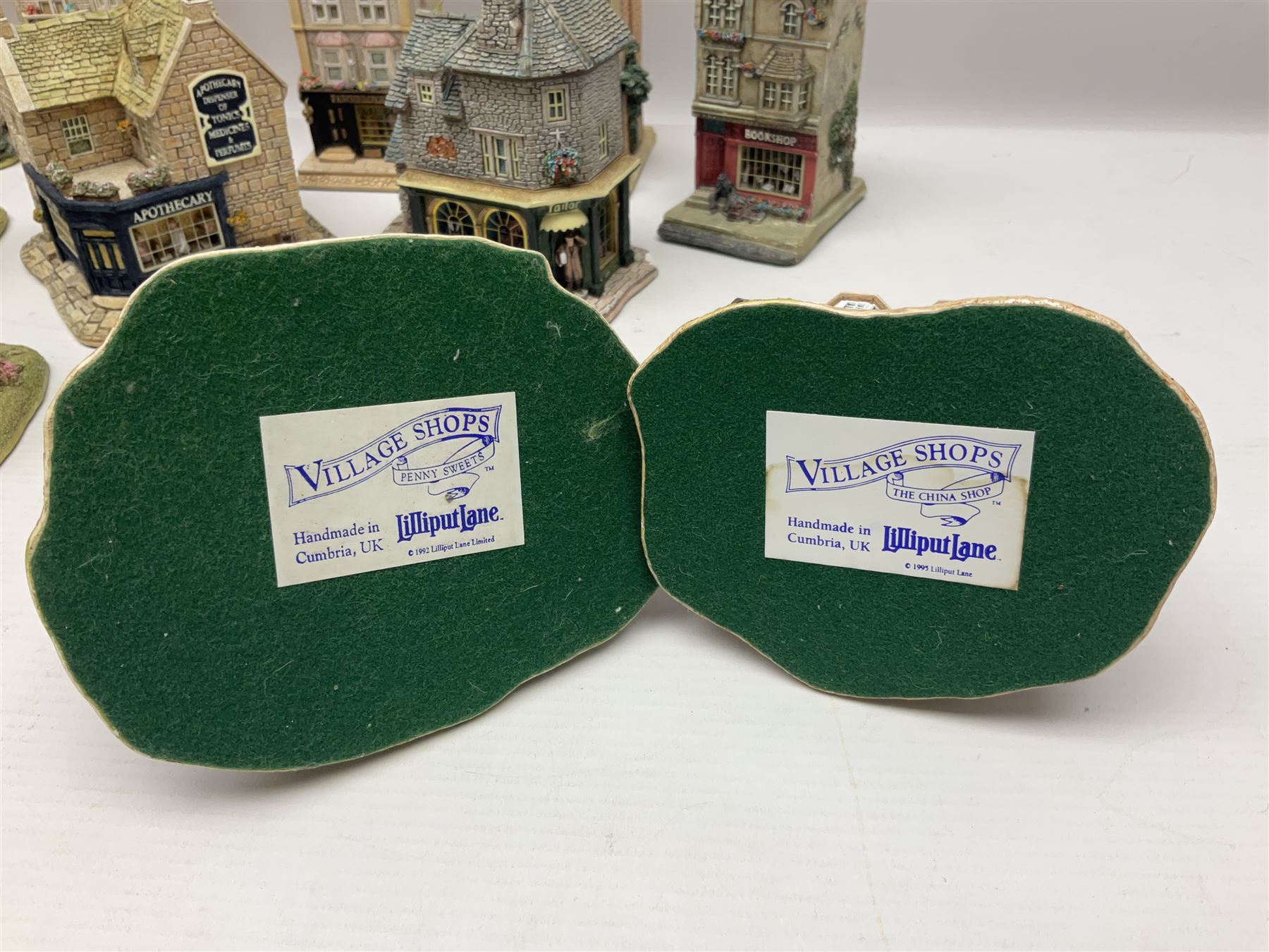 Thirteen Lilliput Lanes from the Shops Collection, including Apothecary, Horologist, China Shop, Penny Sweets, H Samuel etc, all with deeds and original boxes 