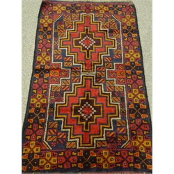  Baluchi red ground rug, two medallions, repeating border, 150cm  88cm  