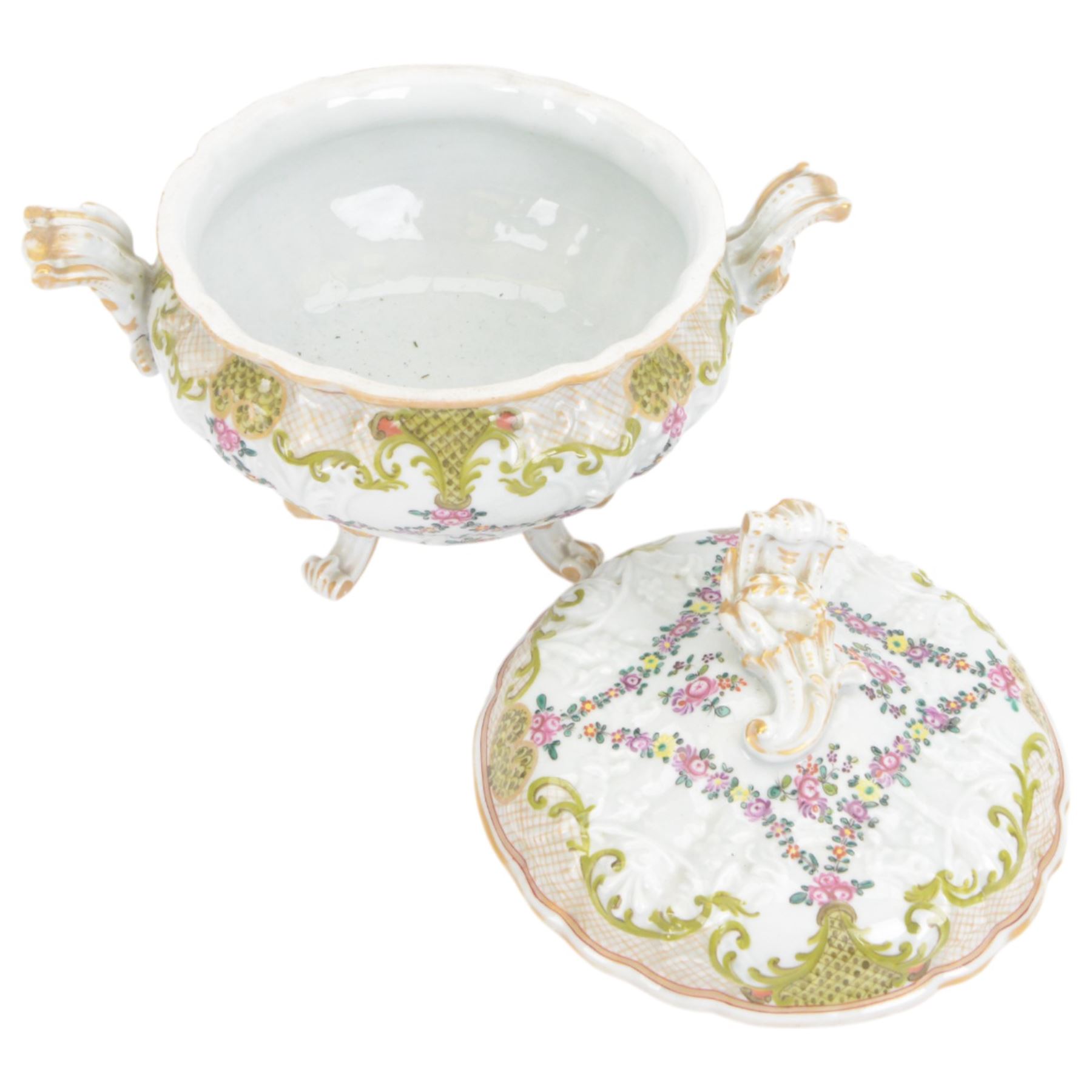 19th Century French faience tureen and cover, decorated with floral swag and net detail with gilt scrollwork handles, raised on four scroll feet, H20cm