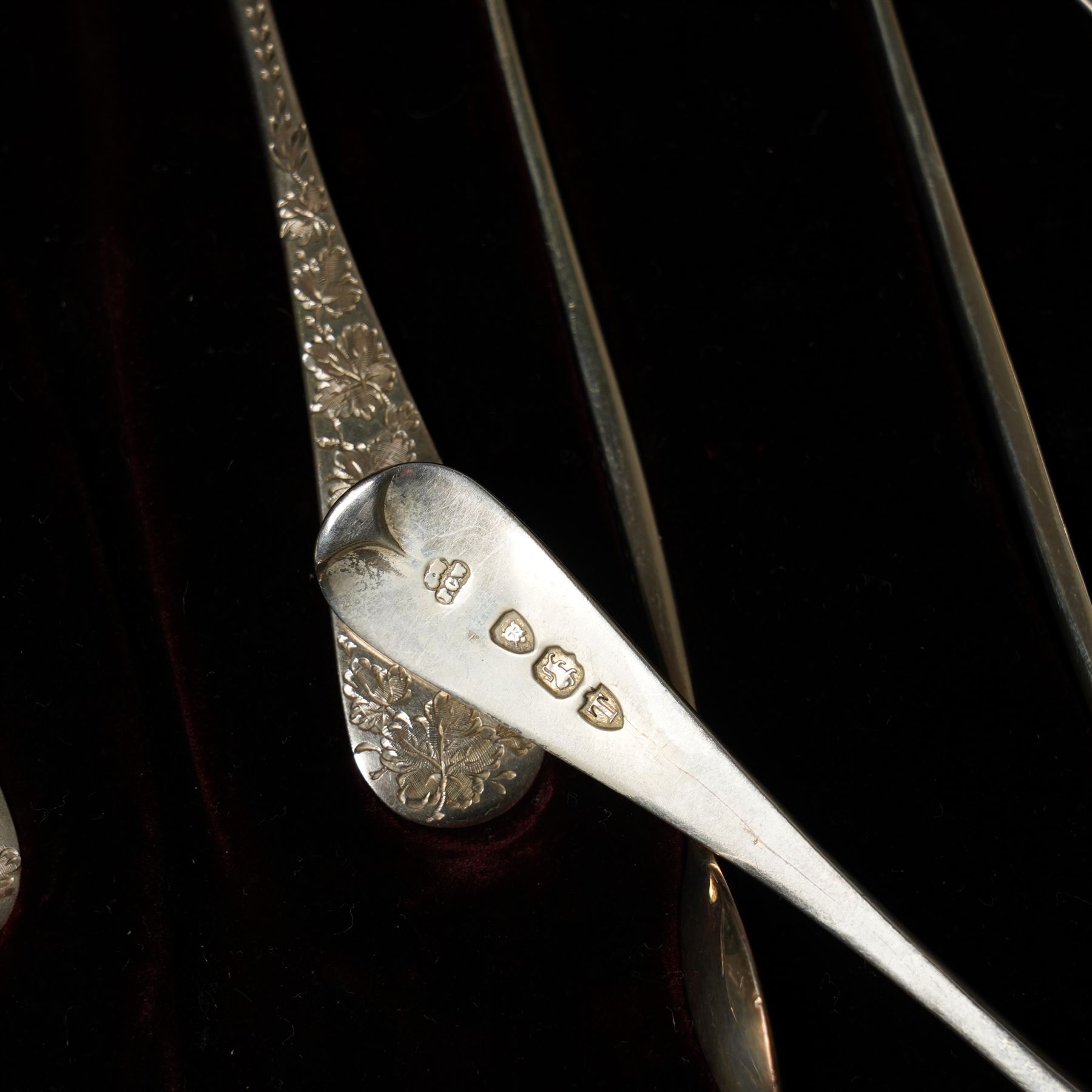 Cased set of twelve Victorian silver tea spoons and tongs with floral engraved stems London 1894 Maker Wakely & Wheeler