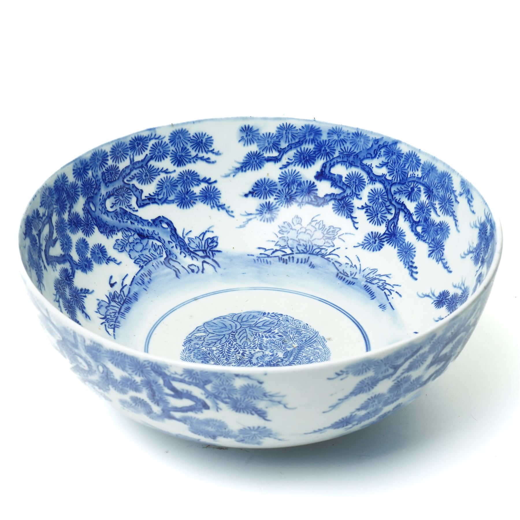 Japanese blue and white bowl, the central bowl painted with bird, surrounded by a border of trees, unmarked, D31cm 