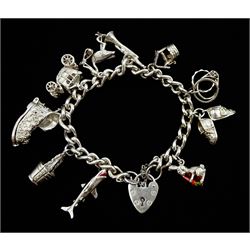 Silver curb link bracelet with heart locket clasp, London 1975, and ten silver charms including shark, rabbit, trumpet and carriage etc 
