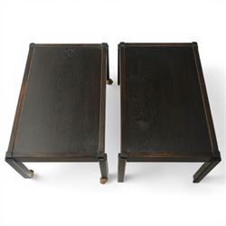 Acornman - dark stained oak two-tier stacking tea trolley, the rectangular removable top, above a second tier raised on castors, with carved acorn signature, by the workshop of Alan Grainger of Brandsby