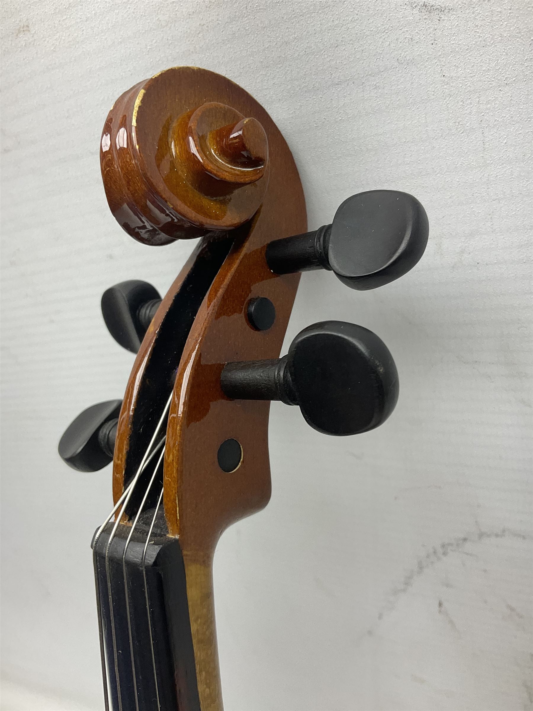 Three Stentor Student violins - three-quarter size with 33cm two-piece back; and two quarter size each with 28cm two-piece back; each in carrying case with bow (3)