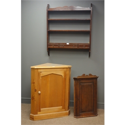  Pine wall corner cupboard single door enclosing two shelves, (W70cm, H87cm, D40cm), oak corner cabinet, (W47cm, H75cm, D29cm) and mahogany three tier wall shelf with drawer, (W76cm, H92cm, D13cm)  