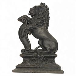 Victorian cast iron figural doorstop in the form of a lion, depicted seated with curled ta...
