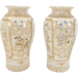 Pair of Japanese Satsuma vases, of baluster form, the panels decorated with immortals and children in a garden, H24cm 