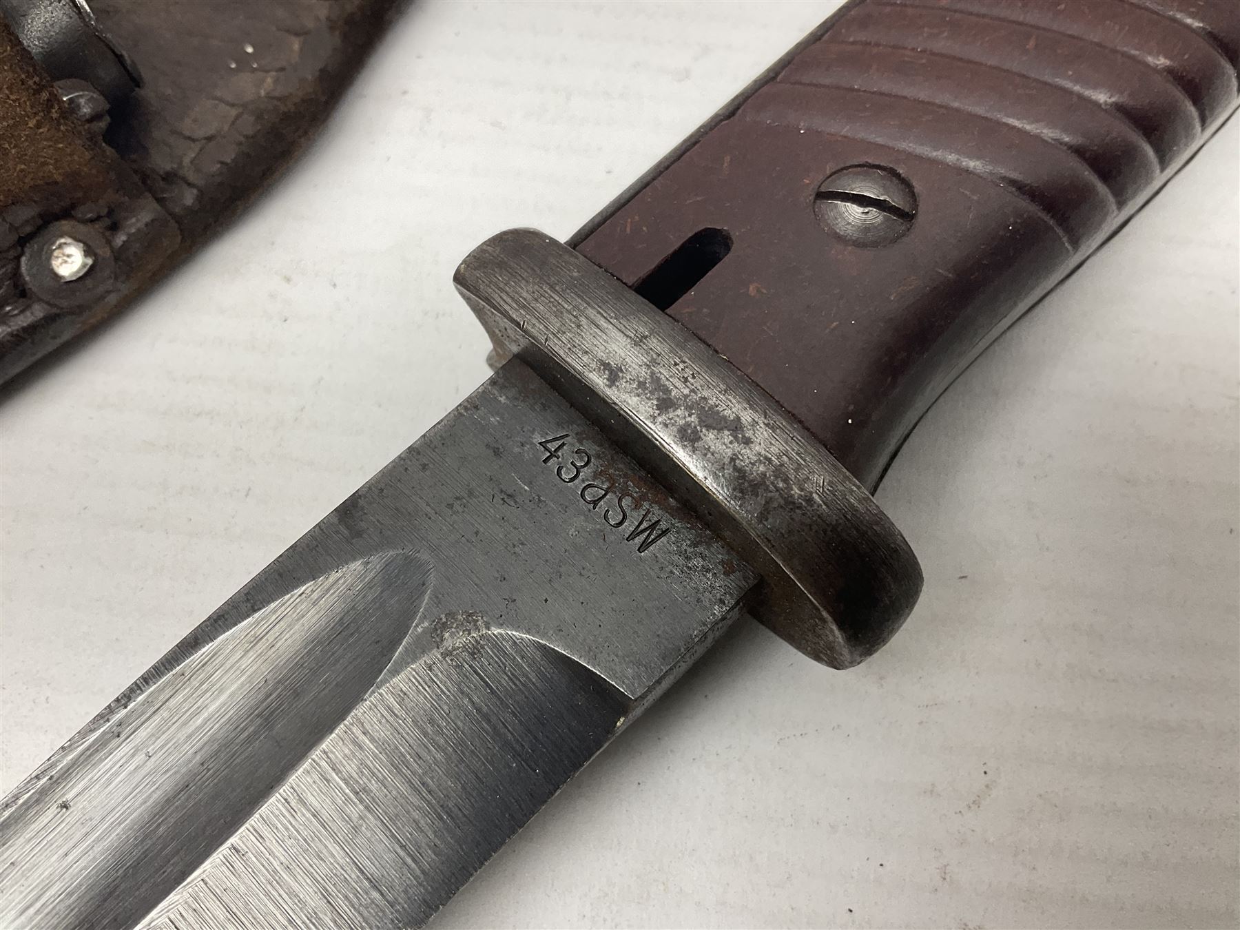WWII German K98 Mauser bayonet by E. & F. Horster, the 24.5cm fullered blade marked 43aSW for 1943, numerous inspection marks to blade and pommel, bakelite grips and bluing to metal parts; in steel scabbard with corresponding numbers and leather frog L42cm overall