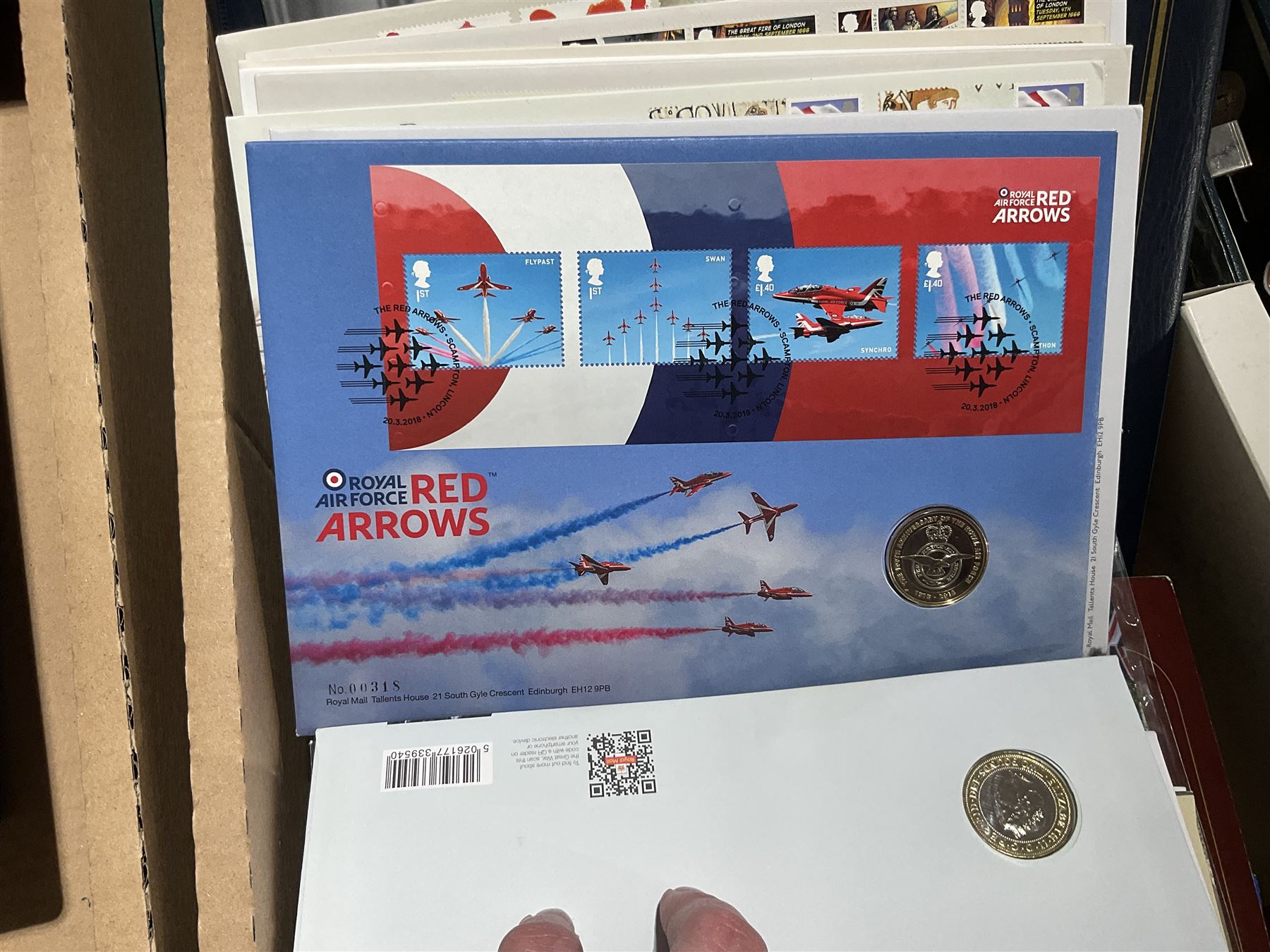 Approximately one hundred and fifteen Royal Mint coin covers, in two ring binder folders and loose, together with approximately 53 grams of Great British pre-1920 and approximately 68 grams of Great British pre-1947 silver threepence coins, and a small quantity of further pre-decimal coins