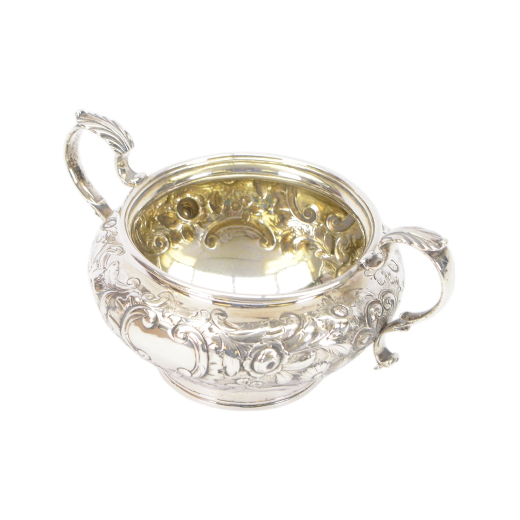 William IV silver twin handled sugar bowl, embossed with flowers and scrolling decoration with acanthus capped twin handles, hallmarked J Wrangham & William Moulson, London 1837, H10cm, D14cm