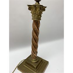 Early 20th century brass and copper Corinthian column table lamp, the square stepped brass base leading to a spiral twist copper column and brass Corinthian capital, H44.5cm 