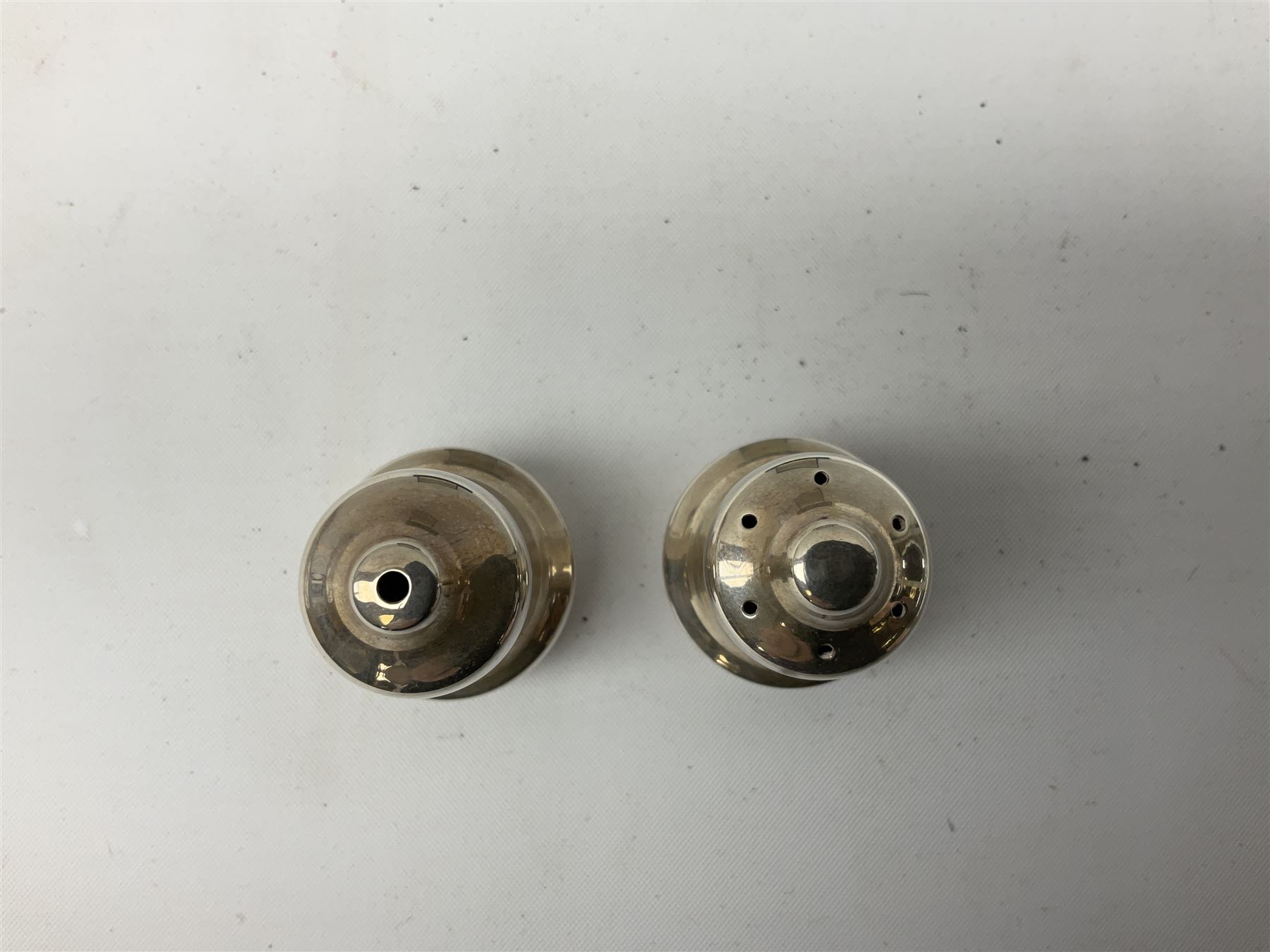 Pair of miniature hallmarked silver cruets, in fitted box, together with a pair of hallmarked silver sugar tongs, approximate total silver weight 38 grams