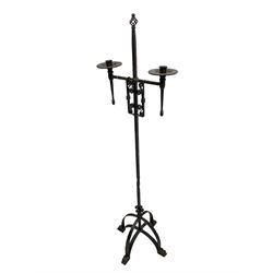 Ironwork candle holder stand, with stamped decoration, adjustable two branch sconces with scrolled iron work, twist stem with arched supports with scrolled terminals