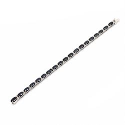 18ct white gold sapphire and diamond bracelet, twenty-three oval cut sapphires, each space...