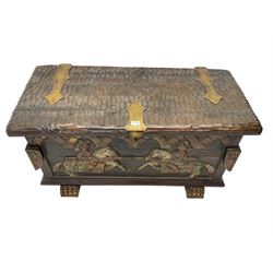 Carved wooden blanket chest, the tooled hinged lid with shaped metal strap hinges and catch, the front carved with arcade over two medieval jousters, on carved sledge feet