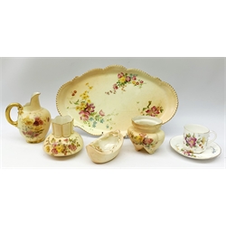  A group of Royal Worcester blush ivory, comprising an shaped oval tray, L32cm, small ewer, H12.5cm, a miniature vase of squat lobed form, H7.5cm, and another vase of squat bulbous form, H8.5cm, each decorated with hand painted floral sprays, together with a Worcester Locke & Co vase of boat form, and a small Royal Worcester teacup and saucer, hand painted with flowers, all with printed mark beneath.   