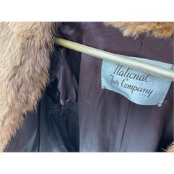 Brown mid length musquash fur coat by National Fur Company together with white rabbit cape