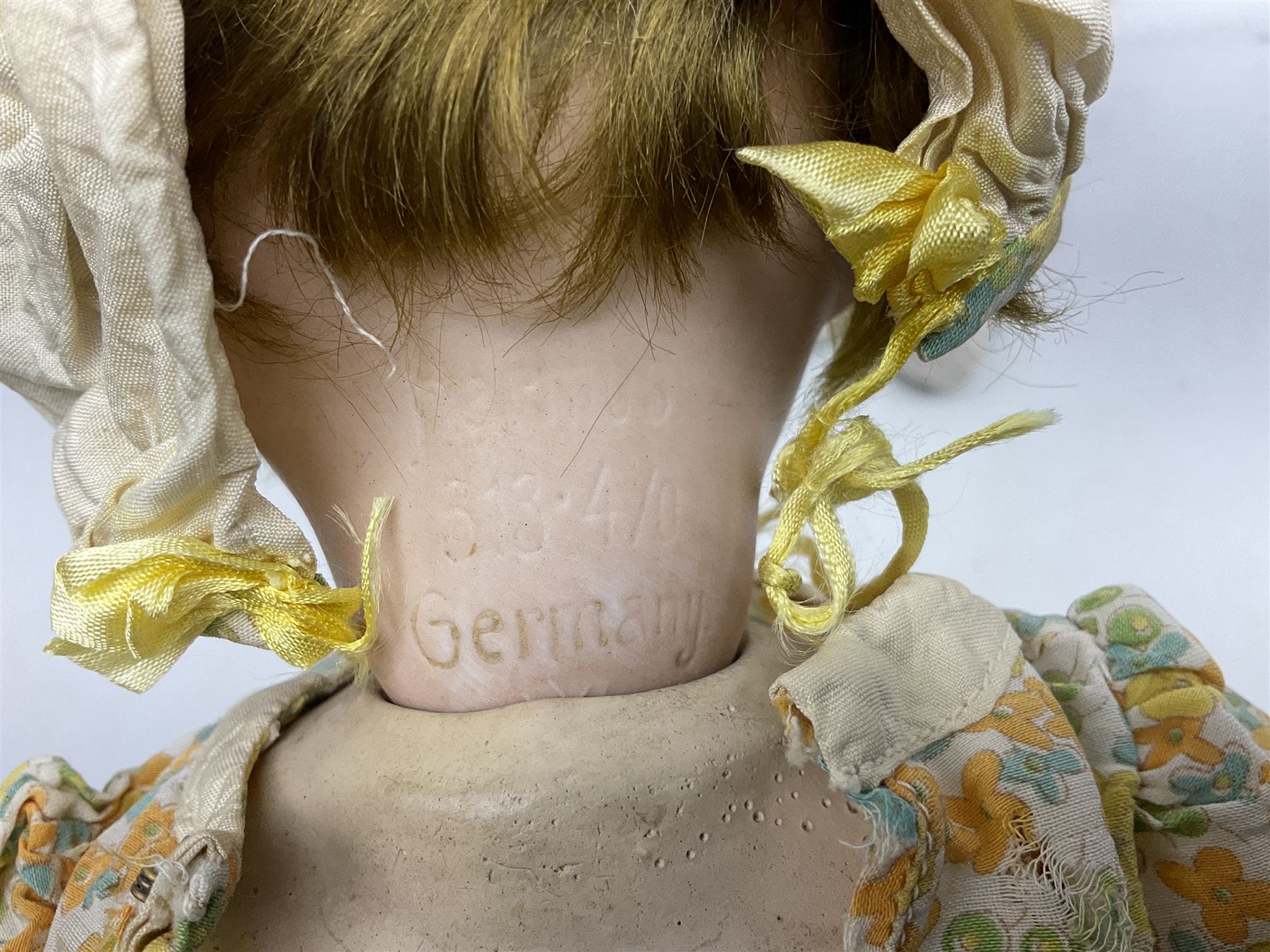 Carl Harmus Germany bisque head doll with applied hair, sleeping eyes, open mouth with teeth and composition body with jointed limbs; marked 'Harmus 313.4/0 Germany' H38cm; and Alt, Beck & Gottschalk Germany bisque head doll with applied hair, fixed eyes, open mouth with tongue and composition body with jointed limbs H44cm (2)