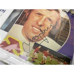 Collection of approximately 200 Leeds United related autographs, predominantly signed newspaper cuttings, contained within ring binder, together with a number of loose examples