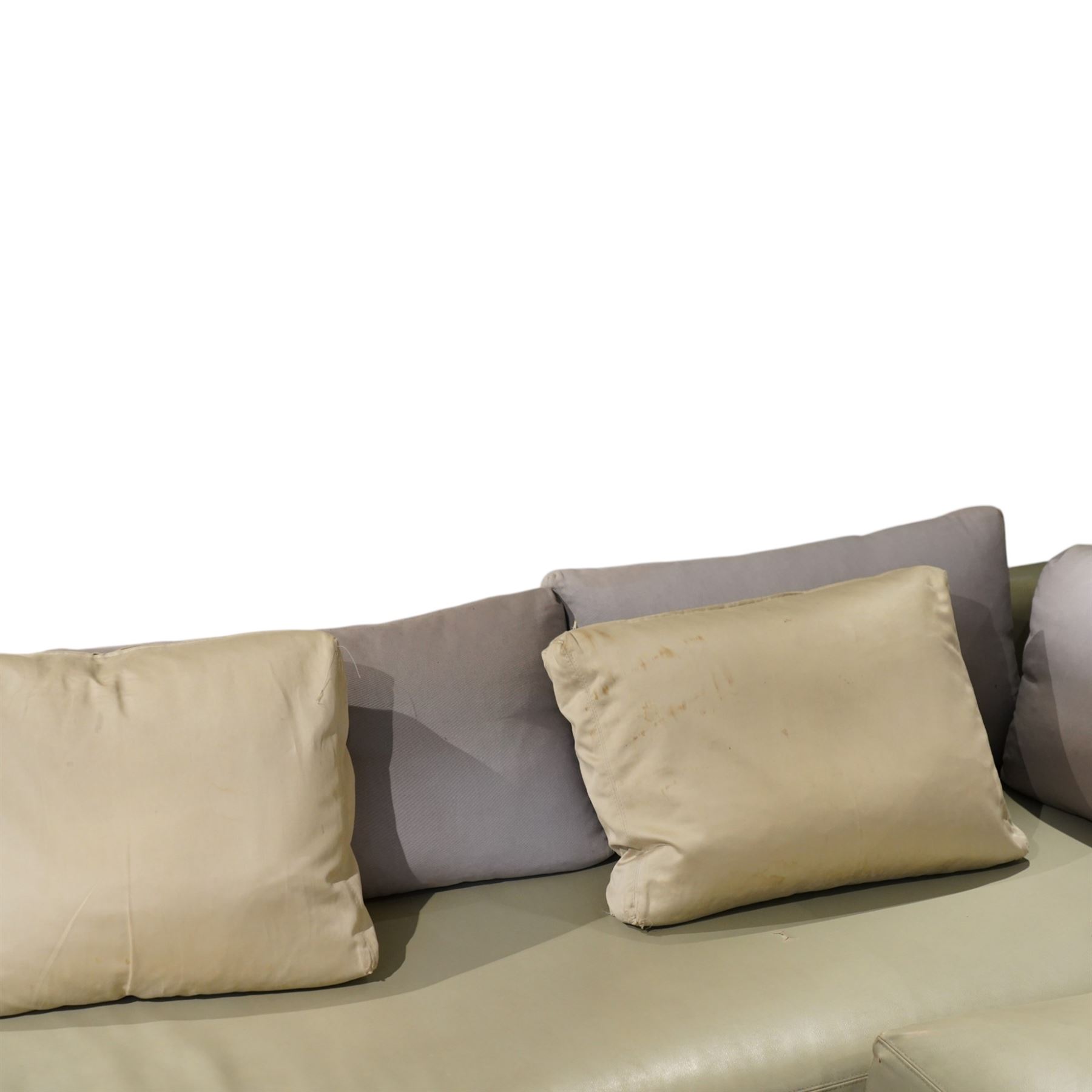 Christian Liaigre (1943-2020) - 'Arpege' handmade L-shaped sectional sofa, upholstered in neutral leather, with broad squared arms, deep seat cushions, angled chaise section, loose back cushions, raised on block feet