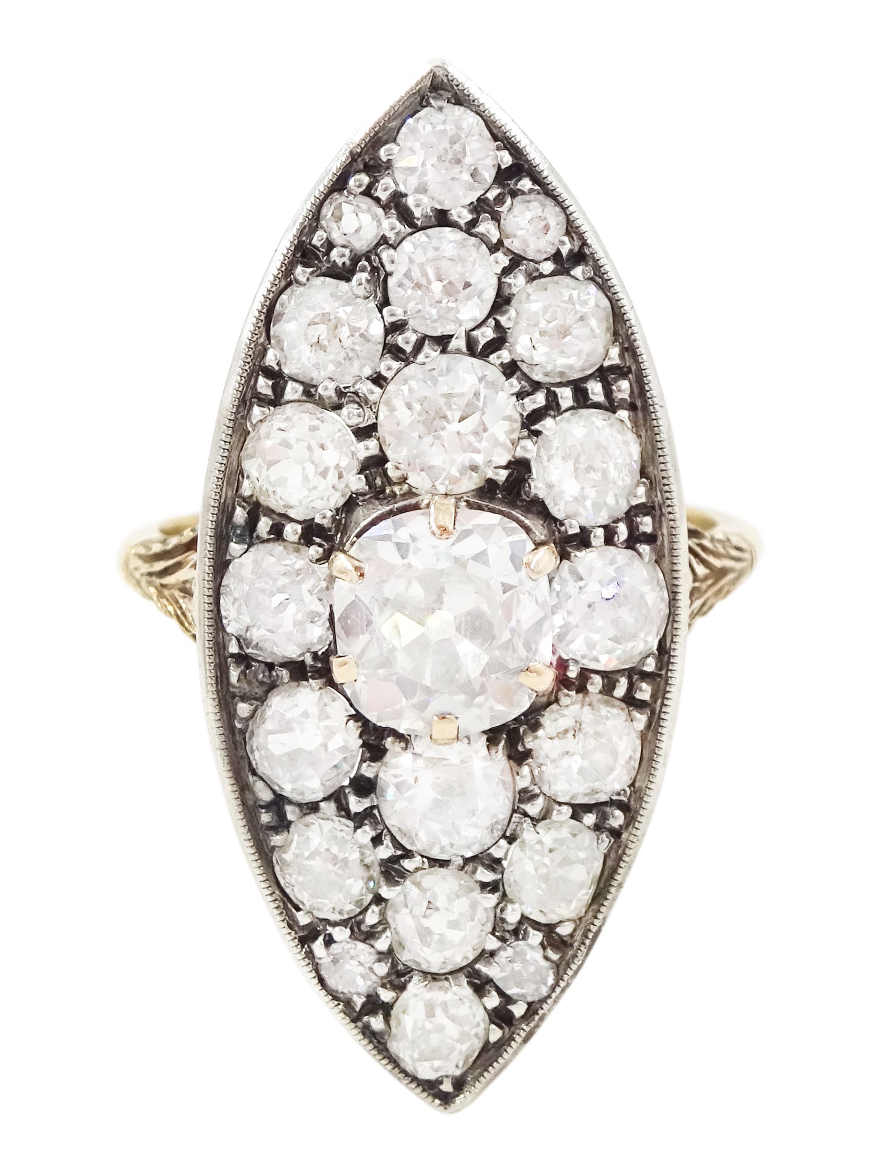 19th century 18ct gold and silver diamond marquise shaped cluster ring, the principal old cut cushion cut diamond of 1.15 carat, in a six claw setting, with pave set old cut diamond surround of 3.28 carat, pierced scroll design gallery and fleur-de-lis shoulders, French (Paris) import mark, total diamond weight 4.43 carat, with IGI report