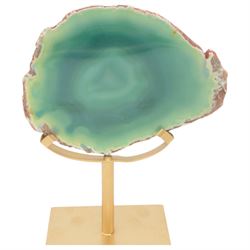 Pair of green agate slices, polished with rough edges raised upon gilt metal stands, H21cm