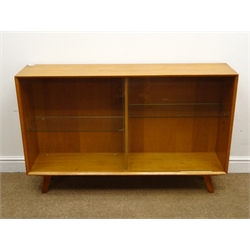  Nathan teak cupboard, single shelf above two panelled cupboard doors, plinth base (W103cm, H75cm, D46cm) a matching small cupboard, single drawer and cupboard (W52cm, H75cm, D46cm) a teak sliding glazed bookcase, a nest of three tables and a retro standard lamp (5)  