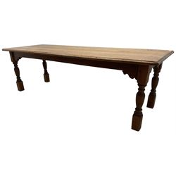 Large Victorian pitch pine farmhouse table, rectangular top with shaped edge, over a shaped apron, raised on turned supports