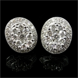  Pair of white gold oval set diamond cluster ear-rings, hallmarked 18ct  
