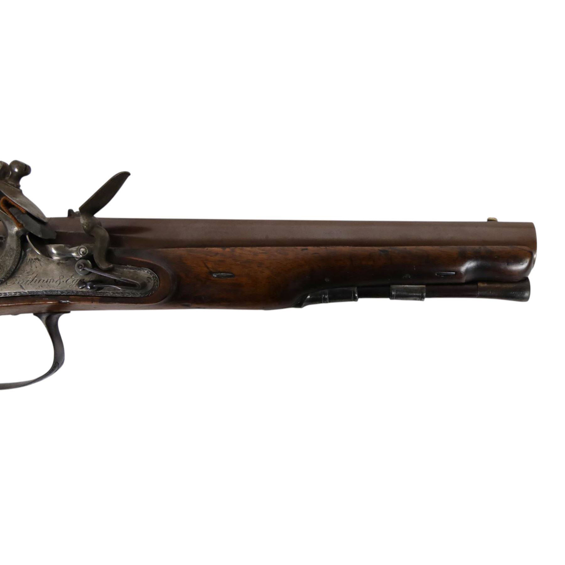 19th century British flintlock pistol by Tatham and Egg, with 21cms Damascus steel sighted barrel with original browning, marked along the top Tatham and Egg London, ramrod beneath, tang and trigger guard engraved with floral scrolls, figured walnut stock with chequered grip and steal butt plate, together with Dixon & Sons Sheffield, three way pistol powder flask, pistol overall L34cm
