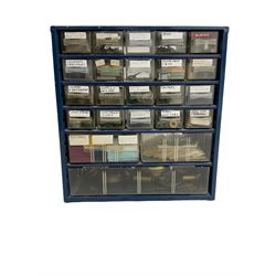 23 draw cabinet with various watch parts including platform escapements, pocket watch bows, wheels, crowns, Jewell’s, fusee's, cylinder balances, plus a number of clock bells and click springs. Plus a box of miscellaneous clock parts.