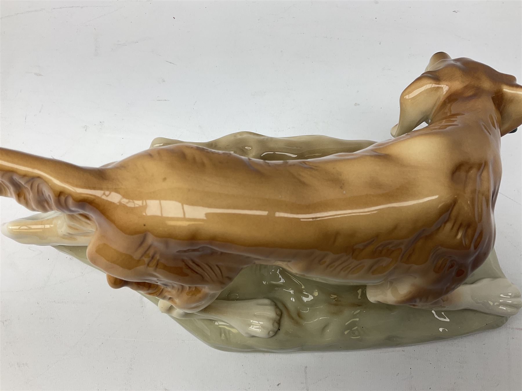 Royal Dux porcelain hunting dog with a bird, printed mark beneath, L36cm