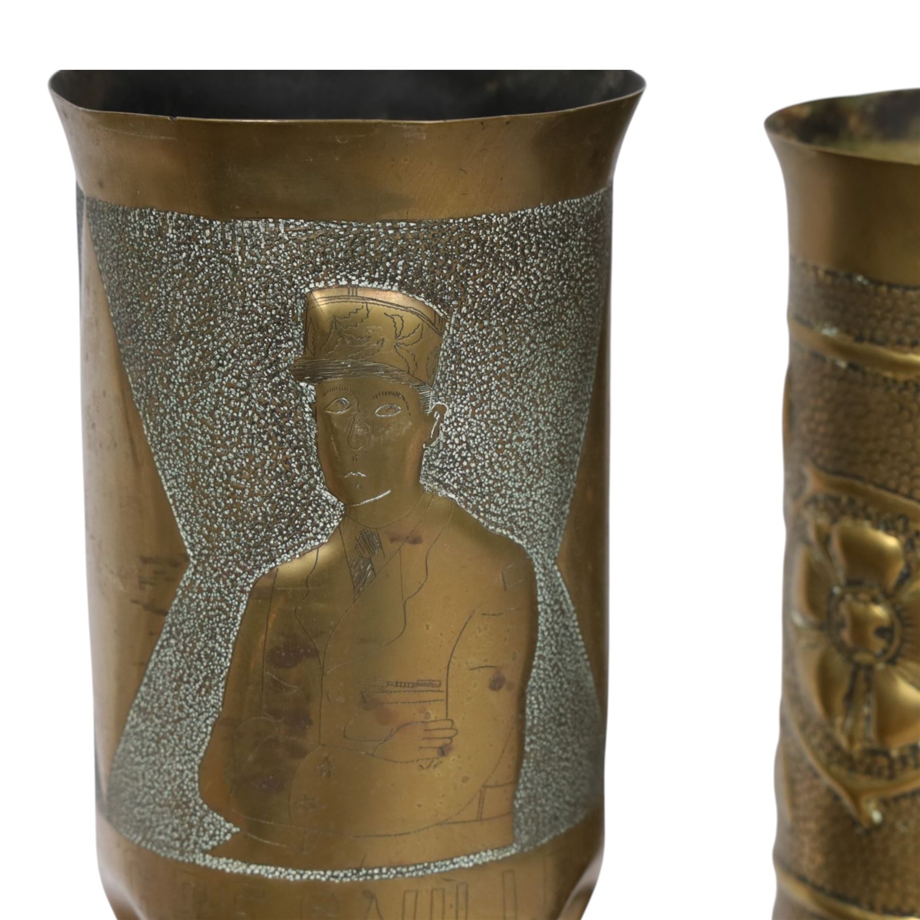 Pair of Second World War Trench Art M14 Shell Cases, each relief-decorated and engraved with a portrait of General de Gaulle, together with another pair decorated with lions and two others, largest H36cm 