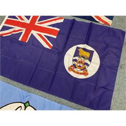 Six flags - White Ensign 180 x 86cm; two Union flags 180 x 86cm and 132 x 62cm; Falklands Islands 153 x 89cm; Yorkshire Rose 153 x 89cm; and QEII 1953 Coronation 84 x 57cm (6)