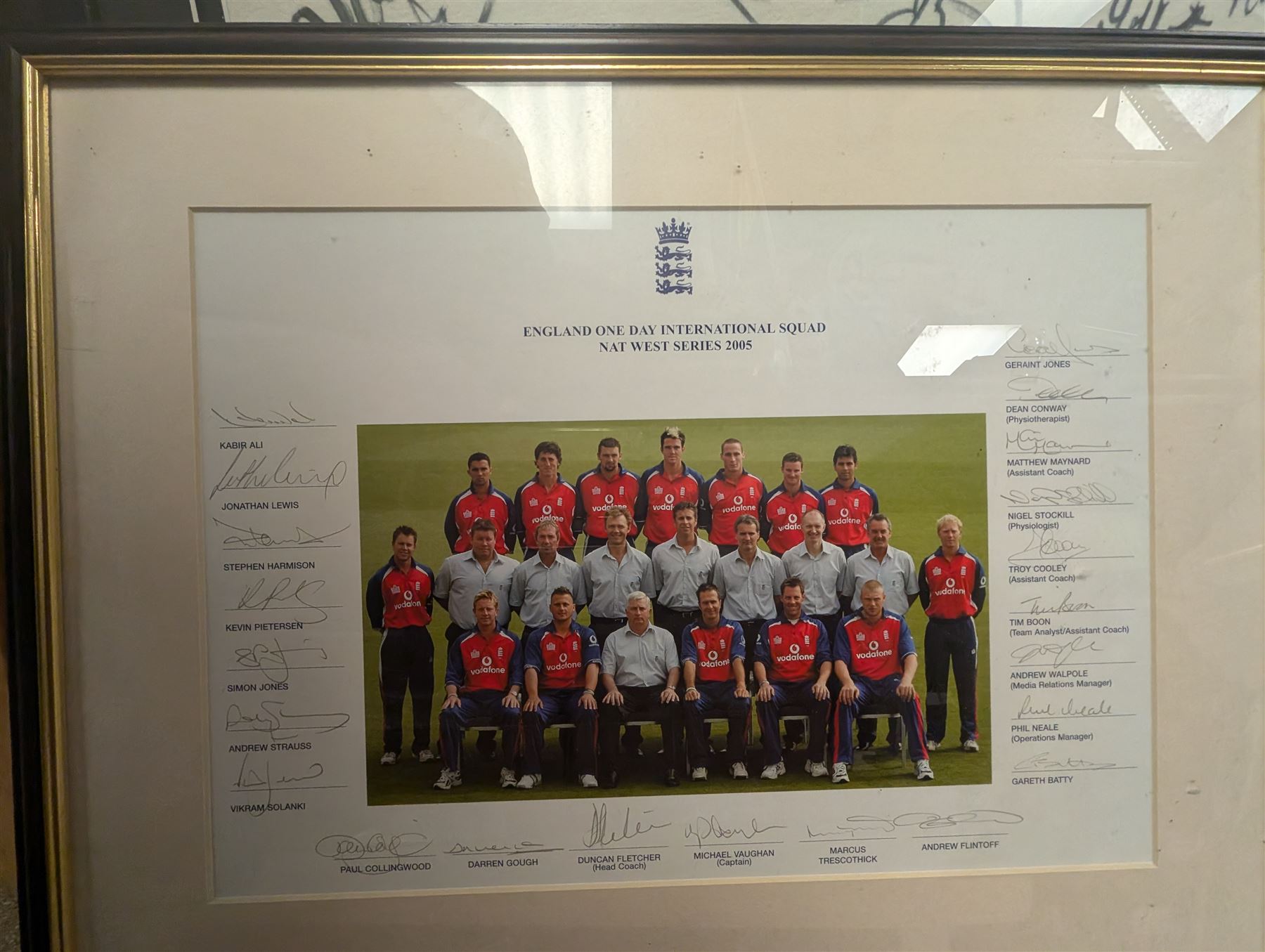 Signed England and Yorkshire cricket memorabilia, including framed bat signed by Michael Vaughn, signed photograph of England team, signed Yorkshire shirt and a signed bat