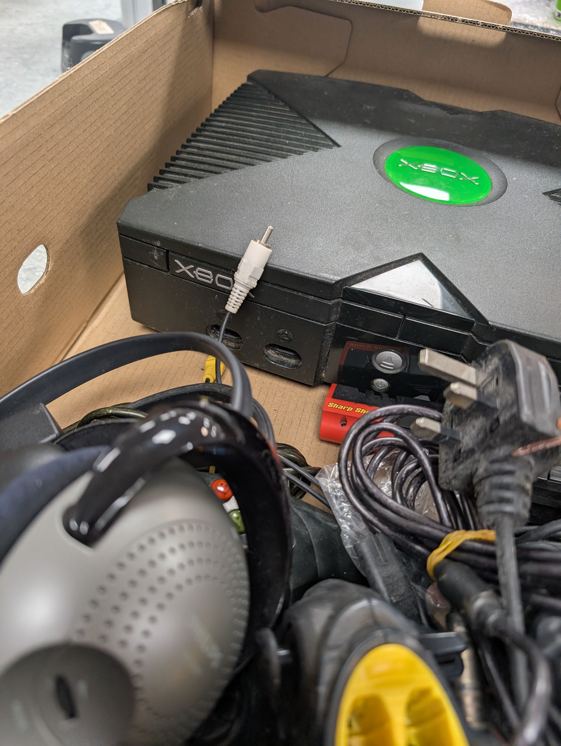 X-Box games console with two controllers, headphones and sharp shooter gun