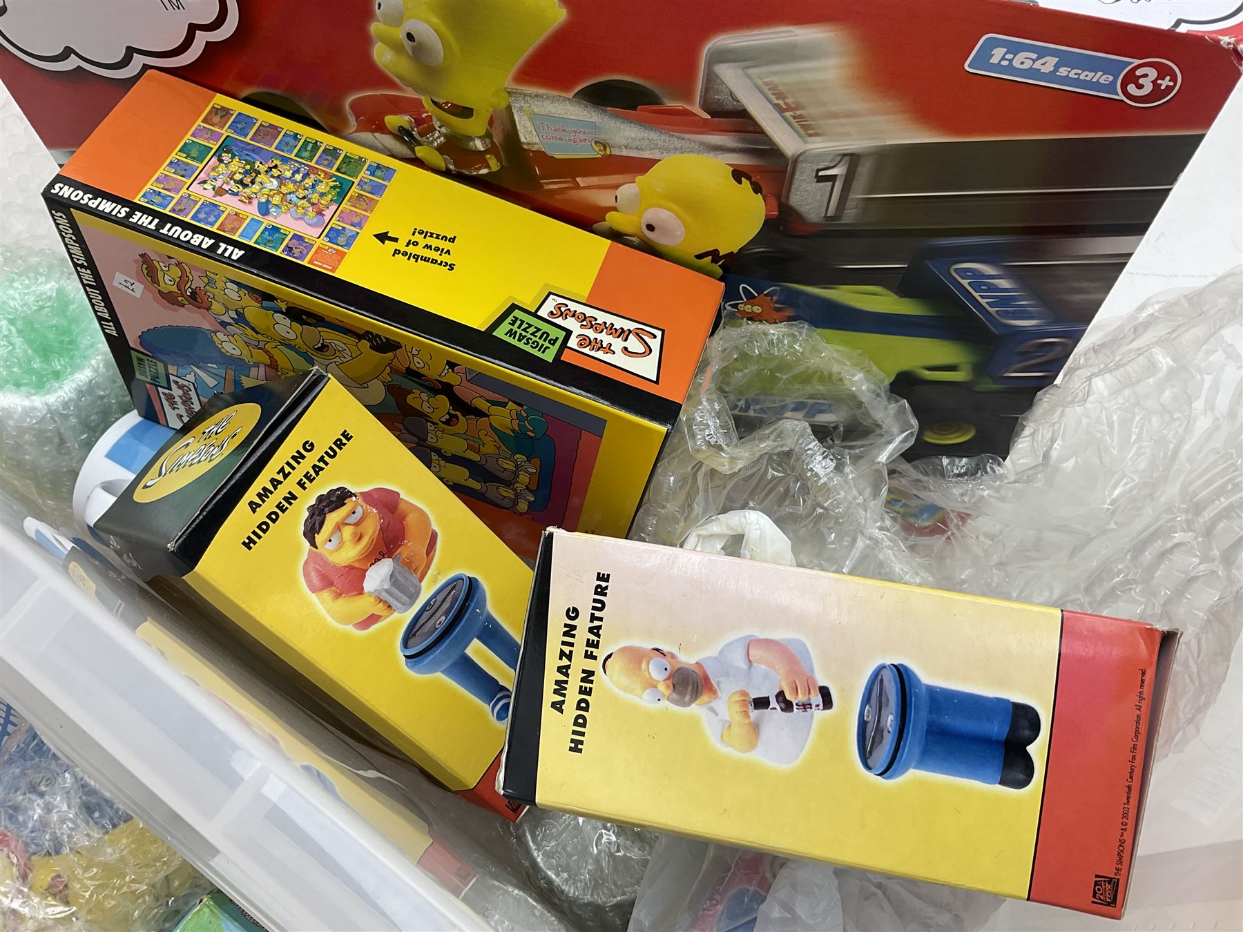 Large quantity of The Simpsons merchandise and memorabilia, to include Micro Scalextric, mugs, jigsaw, bottle openers, solar pal, glasses, etc, many boxed