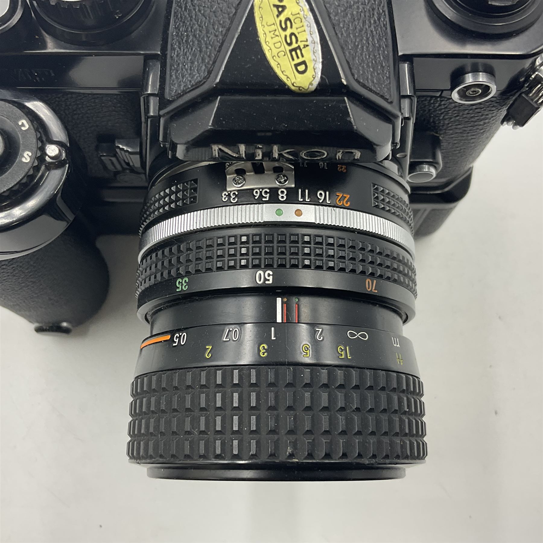 Nikon FM2n camera body, serial no. N8683100, with 'Nikon Zoom-NIKKOR 35-70mm 1:3.3-4.5' len, serial no. 2236565, Nikon MF-16 data back, serial no. 212905 and Nikon MD-12 Motor Drive, serial no 1570382 