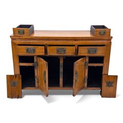 Late 20th-century Thai elm sideboard fitted with an arrangement of three drawers over a central cupboard flanked by a further two drawers, raised on square post feet 