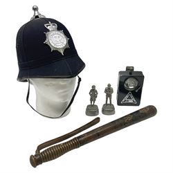 Police - Victorian turned hardwood truncheon with traces of decoration and VR cypher L42cm; Humberside Police helmet with Queens Crown helmet plate; hand lamp inscribed 'The Inspector'; and small pair of pewter figures of police officers (5)