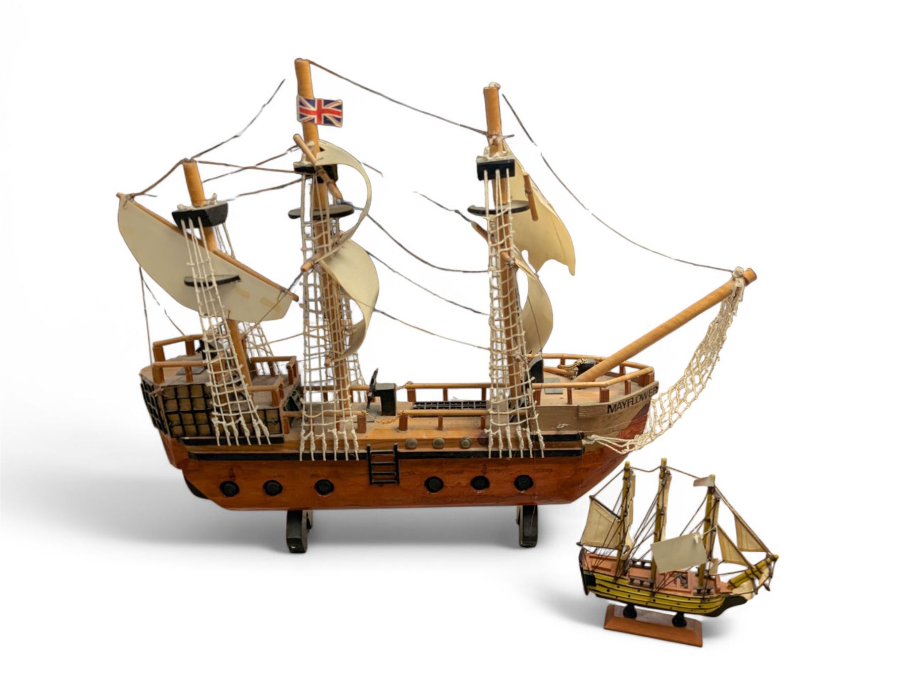 Wooden model ship 'Mayflower', together with a similar smaller example, largest H56cm