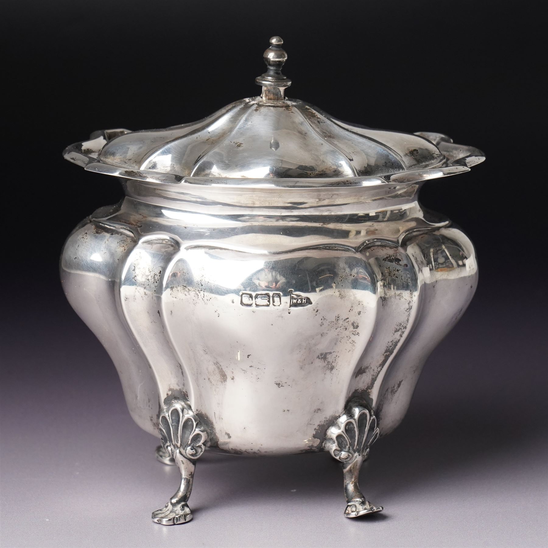 Edwardian silver tea caddy of fluted oval form with shaped supports Sheffield 1903 Maker Walker & Hall  