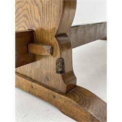‘Gnomeman’ oak dining table, rectangular adzed top, shaped end supports on sledge feet joined by pegged stretcher, carved with gnome signature, by Thomas Whittaker of Littlebeck