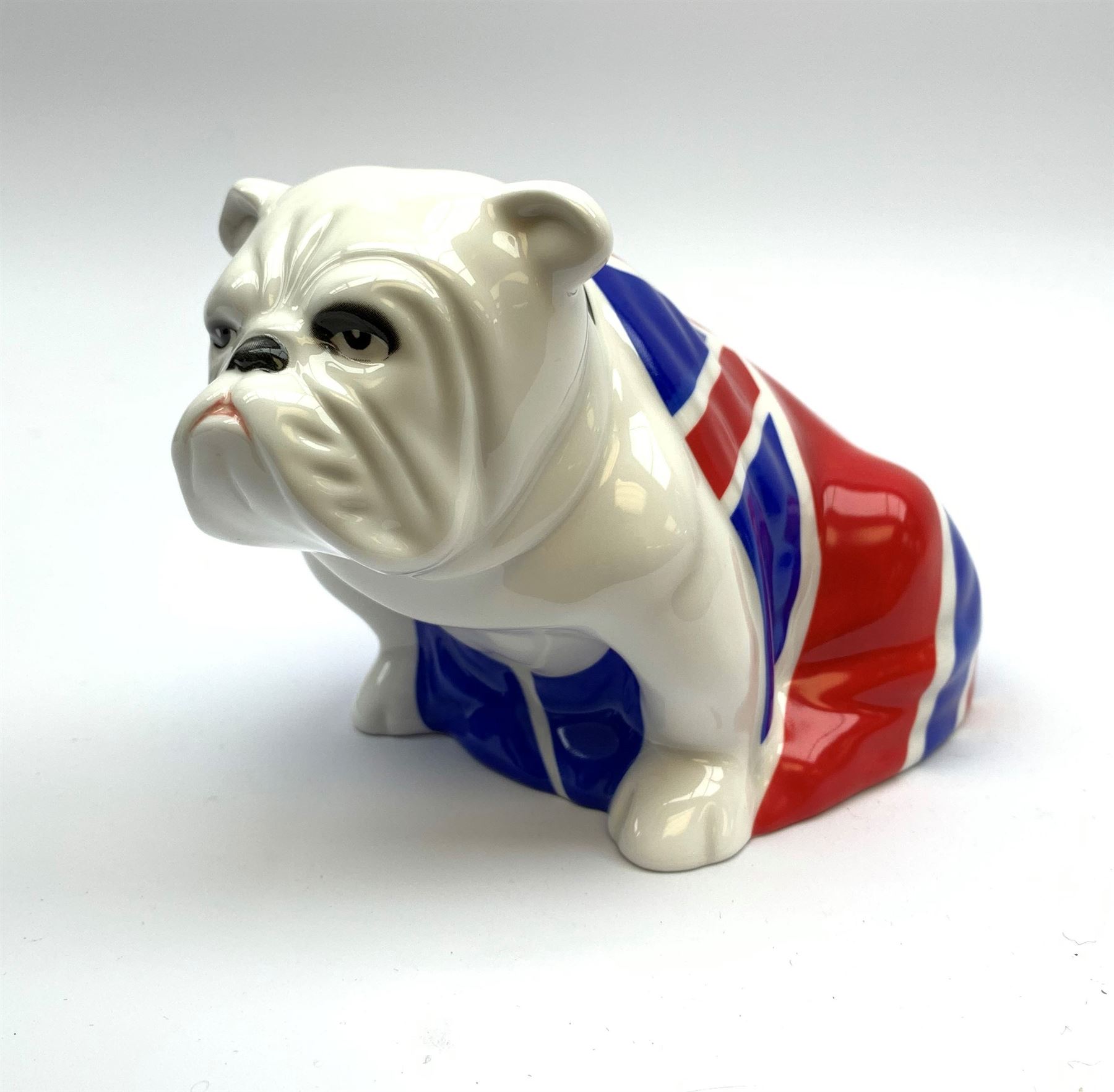 A Royal Doulton Skyfall 007 figure, modelled as a bulldog draped with a Union Jack and entitled Jack, numbered DD007 