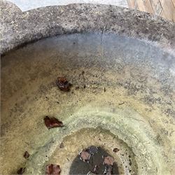 Large 19th century circular stone mortar planter on wrought iron stand