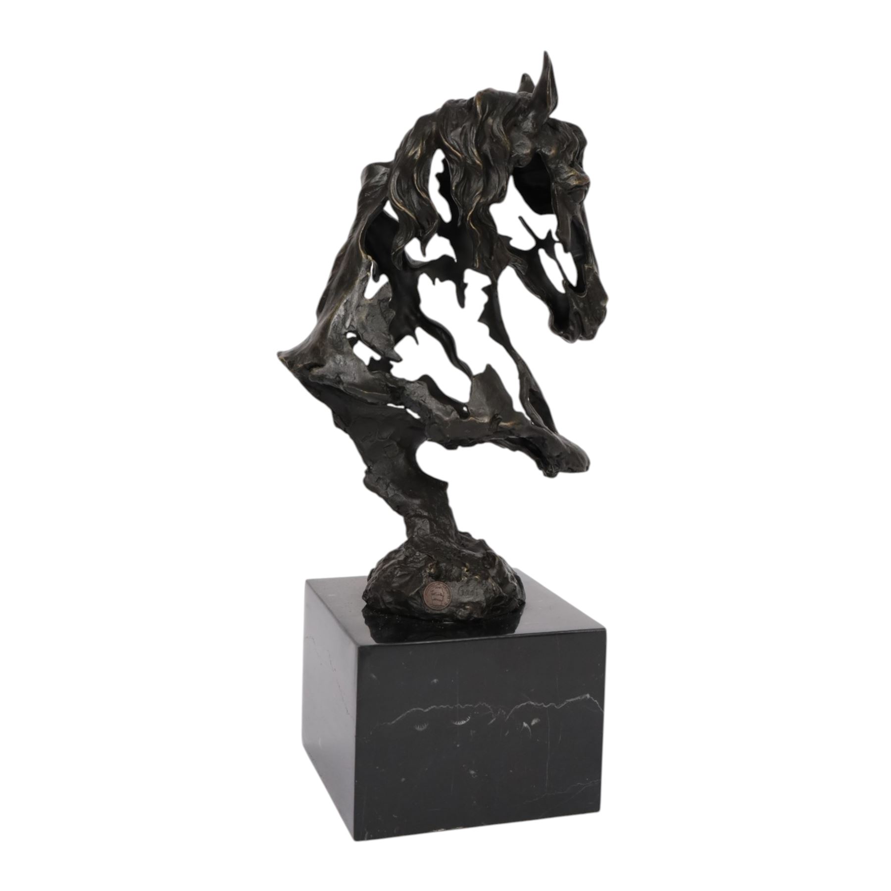 Stylised bronze model of an openwork horses head, signed Gadi and with foundry mark, raised upon black marble plinth, H41cm