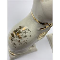 Pair of Victorian Staffordshire cats, modelled seated upon cushions, with gilt detail throughout, H18cm